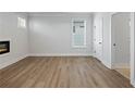 Spacious bedroom with hardwood floors and a modern fireplace at 4074 Hosch Retreat Dr, Buford, GA 30519