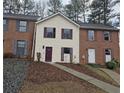 Exterior view of a two-story house with a walkway, set in a neighborhood with mature trees at 6002 Pat Mell Se Pl, Smyrna, GA 30080