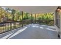 Inviting covered porch with wooden railings at 1679 Hollyhock Ter, Decatur, GA 30032