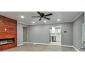 Modern living room with fireplace and wood accent wall at 1679 Hollyhock Ter, Decatur, GA 30032