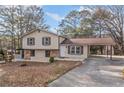 Ranch home with carport and landscaping in the front yard at 2491 Crumps Landing Circle, Snellville, GA 30039