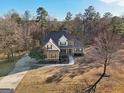 House with a long driveway and wooded backyard at 283 Rosebay Ln, Sharpsburg, GA 30277