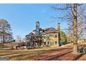 Large house with stone exterior and a deck at 283 Rosebay Ln, Sharpsburg, GA 30277