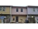 Rear view of townhouse showing a private patio and shared fence at 3551 Brycewood Dr, Decatur, GA 30034