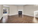 Bright living room featuring hardwood floors and a fireplace at 1538 Park Grove Dr, Lawrenceville, GA 30046