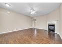 Living room with hardwood floors, fireplace, and access to other rooms at 1538 Park Grove Dr, Lawrenceville, GA 30046