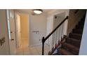 View of the entryway with staircase and half bath at 2082 Montgomery Trl, Duluth, GA 30096