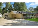 View of house from the side, showing a detached shed at 102 Chip Pl, Stockbridge, GA 30281