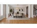 Formal dining room with hardwood floors, modern lighting, and elegant decor at 4974 Dovecote Trl, Suwanee, GA 30024