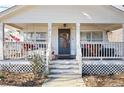 Inviting front porch with a swing and decorative accents at 3170 New Macland Rd, Powder Springs, GA 30127