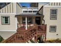 View of front door and porch with wood railings, steps, and seating area at 1775 Jody Ne Dr, Marietta, GA 30066