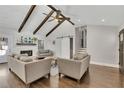 Bright living room featuring wood floors, barn door, fireplace, and comfortable seating at 1775 Jody Ne Dr, Marietta, GA 30066