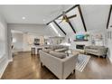 Open concept living room with high ceilings, exposed beams, and a fireplace at 1775 Jody Ne Dr, Marietta, GA 30066