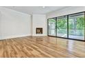 Spacious living area with hardwood floors, fireplace and access to a deck at 2179 William Way, Atlanta, GA 30345