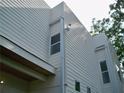 Exterior of the house showing siding and security camera at 48 Moury Se Ave, Atlanta, GA 30315