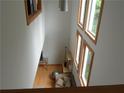 High-ceiling living room with hardwood floors and lots of natural light at 48 Moury Se Ave, Atlanta, GA 30315