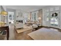 Bright and airy living room with hardwood floors and fireplace at 115 17Th Street Ne, Atlanta, GA 30309