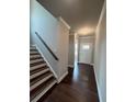 Bright foyer with hardwood floors and elegant staircase at 269 Lakeside Pl, Canton, GA 30114
