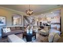 Comfortable living room with modern lighting and hardwood flooring throughout at 11360 Bennett Ln, Johns Creek, GA 30097