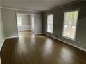 Spacious living room with hardwood floors, large windows, and an open floor plan at 2812 Arlington Rd, Atlanta, GA 30344
