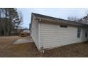 Rear of house showing a patio, deck, and fenced backyard at 6627 Coventry Pt, Austell, GA 30168