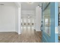 Inviting foyer showcases wood-look floors and an open view to the living area with loads of natural light at 11335 Bennett Ln, Johns Creek, GA 30097