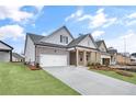 Attractive single-Gathering home with brick accents, well-kept lawn, and a two-car garage at 161 Mooney Rd, Woodstock, GA 30188
