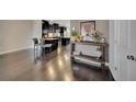 Open-concept space with hardwood floors, connecting the living area and modern kitchen seamlessly at 4178 Butler Dr # 98, Atlanta, GA 30341