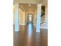 Bright foyer with hardwood floors, columns, and views to the back at 416 Aristides Way, Canton, GA 30115