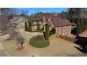 Large brick house situated on a spacious lot with landscaping at 511 Baxter Way, Marietta, GA 30064