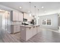 Modern kitchen with stainless steel appliances, granite countertops, and a spacious island at 202 Bryon Ln, Acworth, GA 30102