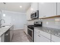 Well-equipped kitchen with modern appliances, granite countertops, and ample cabinet space at 202 Bryon Ln, Acworth, GA 30102