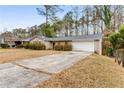 Front view of a ranch house with driveway at 2828 The Meadows Way, Atlanta, GA 30349