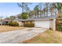 Ranch style home with a long driveway at 2828 The Meadows Way, Atlanta, GA 30349