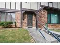 Townhouse entrance with brick and stonework at 1190 Ashborough Se Dr # C, Marietta, GA 30067