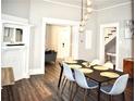 Contemporary dining area featuring a stylish chandelier and hardwood floors at 531 Connally St, Atlanta, GA 30312