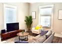 Comfortable living room featuring modern furniture, large windows, and decorative accents at 531 Connally St, Atlanta, GA 30312