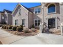 Brick home with a walkway leading to an elegant entryway at 4361 River Vista Rd, Ellenwood, GA 30294