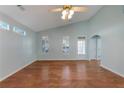 Spacious living room featuring hardwood floors and vaulted ceilings at 615 Brookwater Dr, Stockbridge, GA 30281