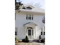 White two-story house with a classic design, gray roof, and manicured landscaping at 2583 Habersham Nw Rd, Atlanta, GA 30305