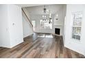 Bright living room featuring hardwood floors, a fireplace, and plenty of natural light at 2374 Suwanee Pointe Dr, Lawrenceville, GA 30043