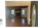 Living room with hardwood floors and a brick fireplace at 3428 Vandiver Dr, Marietta, GA 30066