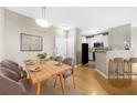 Dining area with wood table and view into kitchen at 821 Ralph Mcgill Ne Blvd # 3216, Atlanta, GA 30306