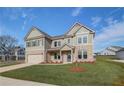 Charming two-story home featuring a brick and siding facade, as well as a spacious two-car garage at 501 Dolce Rd, Locust Grove, GA 30248