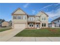 Beautiful two-story home featuring a brick and siding facade, and an attached two-car garage at 501 Dolce Rd, Locust Grove, GA 30248