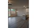 Open-concept living area with bright windows and a door to the outdoor, showcasing modern fixtures and finishes at 1070 Crest Mill Dr, Marietta, GA 30008