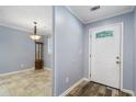 Light blue walls, wood-look floors, and a glass door at 729 Cedar Pointe Sw Ct, Marietta, GA 30008