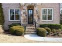 Front entry with stone accents and steps at 2455 Ellijay Ne Dr, Brookhaven, GA 30319