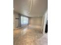 Bright, spacious living room featuring sleek tile floors and large windows at 6625 Starling Sw Pl, Mableton, GA 30126