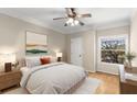 Cozy bedroom with hardwood floors, ceiling fan, and ample natural light at 955 Juniper Ne St # 4331, Atlanta, GA 30309